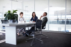 Businesspeople at office desk
