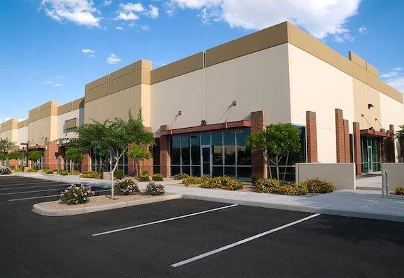 clean shopping center parking lot with slurry seal restriped california