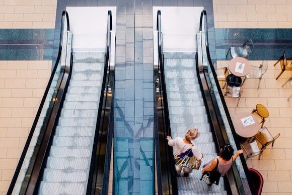 customer safely hold escalator handrails office shopping center safety california