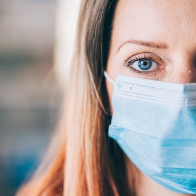 pandemic woman afraid to return to work office or shopping center