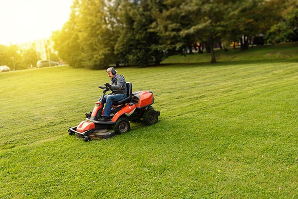 Set mower blades to three inches