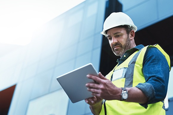 Site manager working on tablet