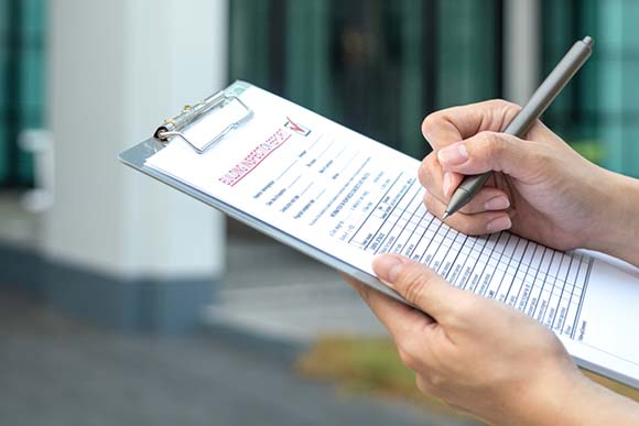 Business owner managing checklist Business owner managing checklist
